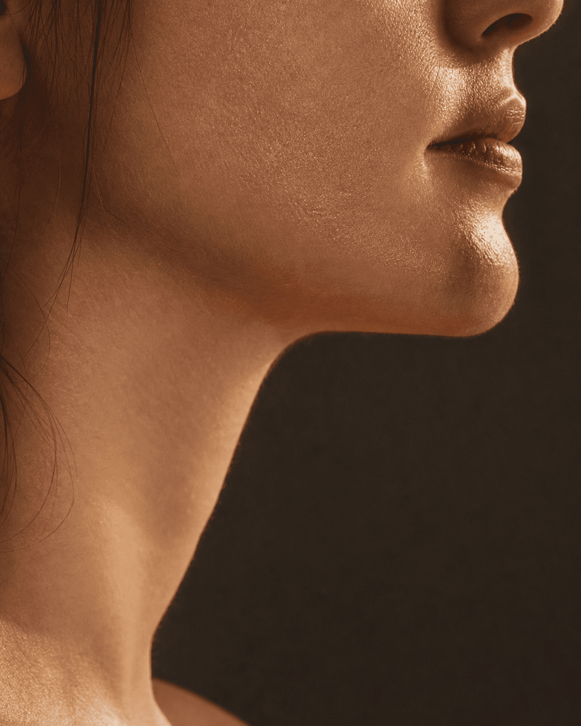 Close detail of bare, healthy skin in warm directional light